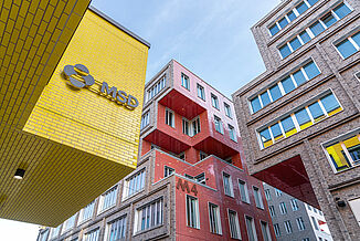 Coloured exterior façade of buildings at the Macherei in Munich.